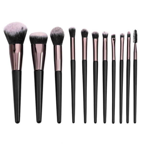 Professional 11-piece makeup brush set with natural wood handles and rose gold ferrules.