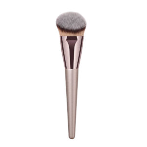 Front view of the champagne gold foundation brush with soft synthetic bristles