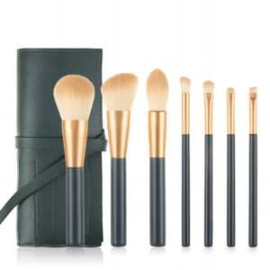 Professional 7-piece makeup brush set with dark blue handles and vegan leather case